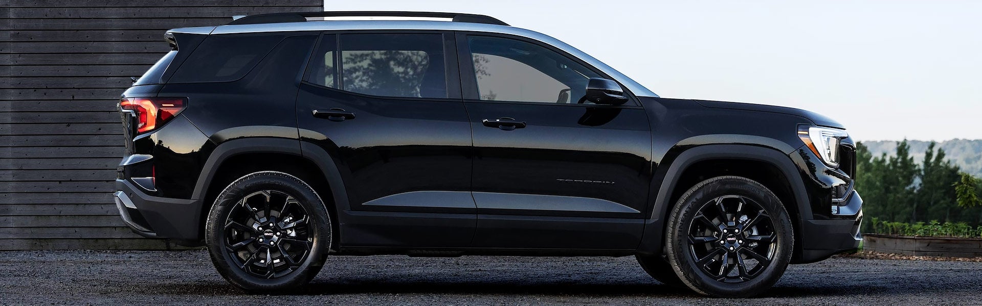 A black suv sitting parked.