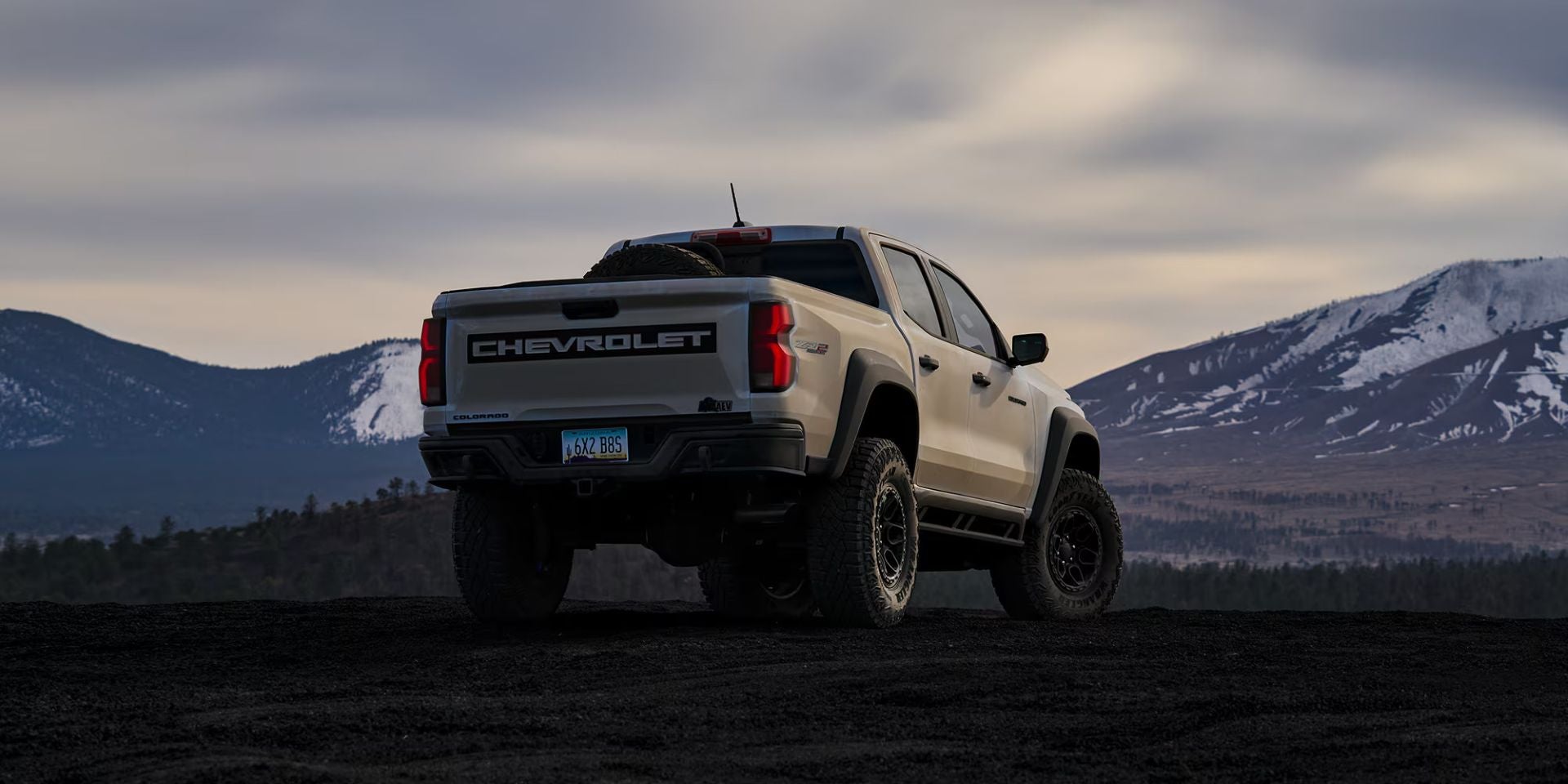 A white truck sitting parked.