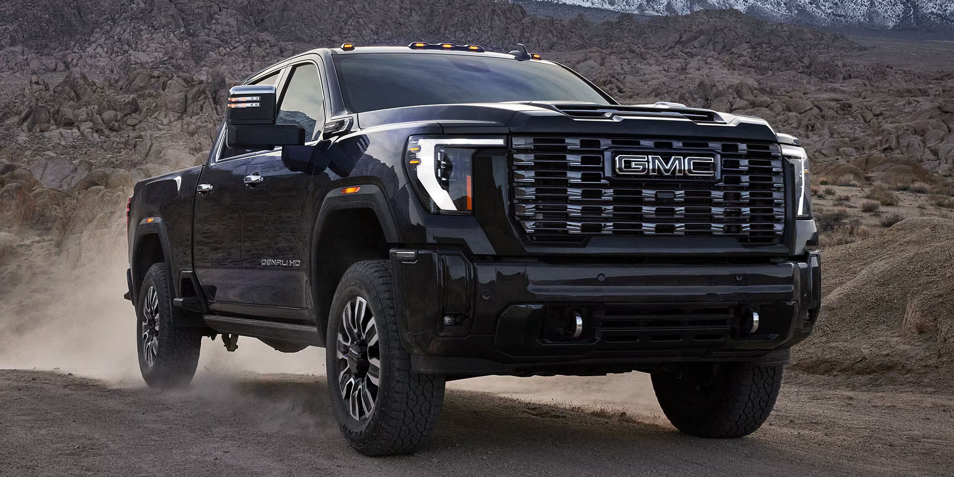 A black truck sitting parked.