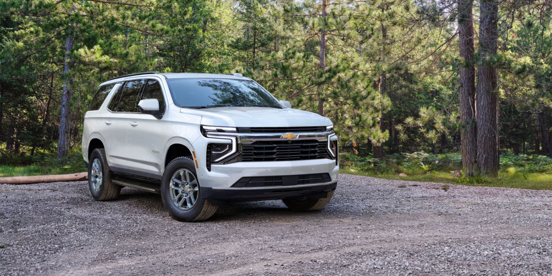 A white suv sitting parked.