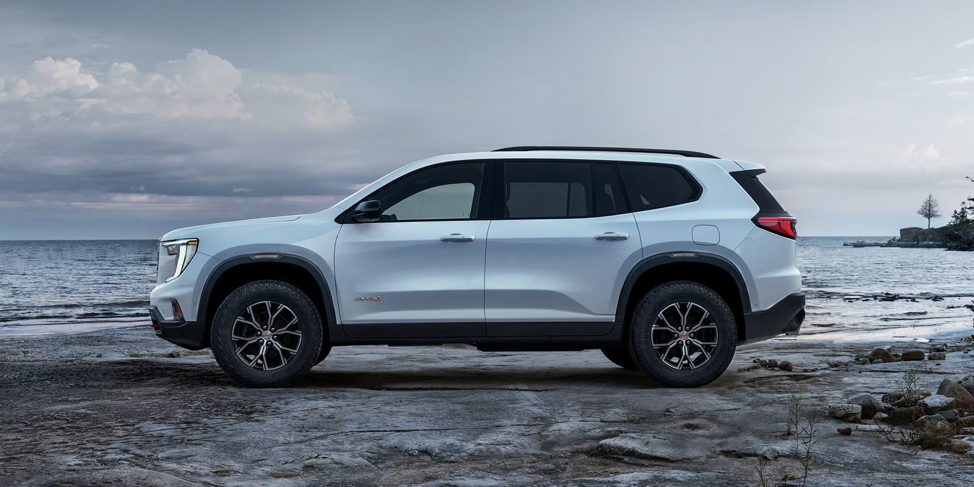 A white suv sitting parked.