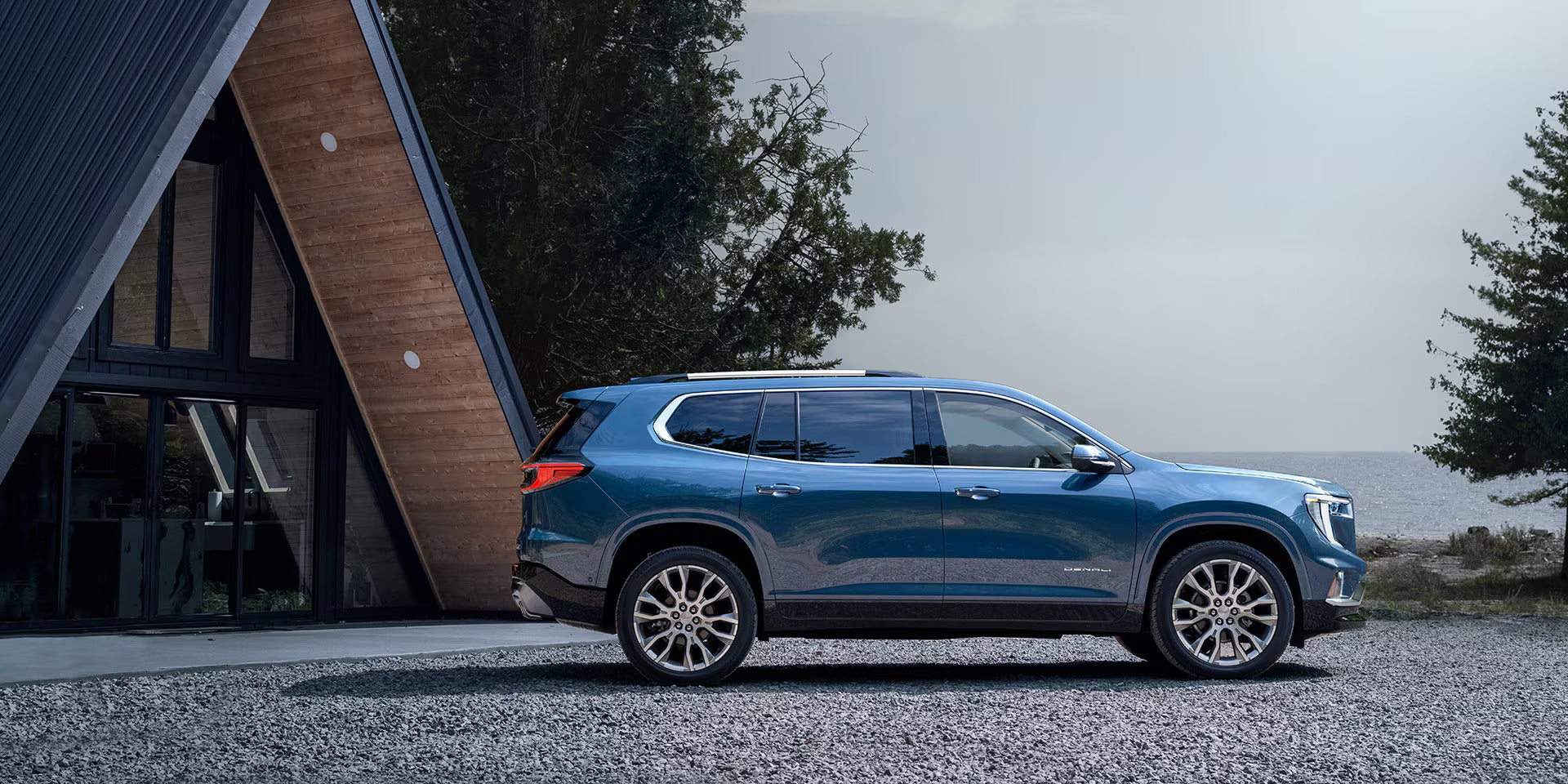 A blue suv sitting parked.