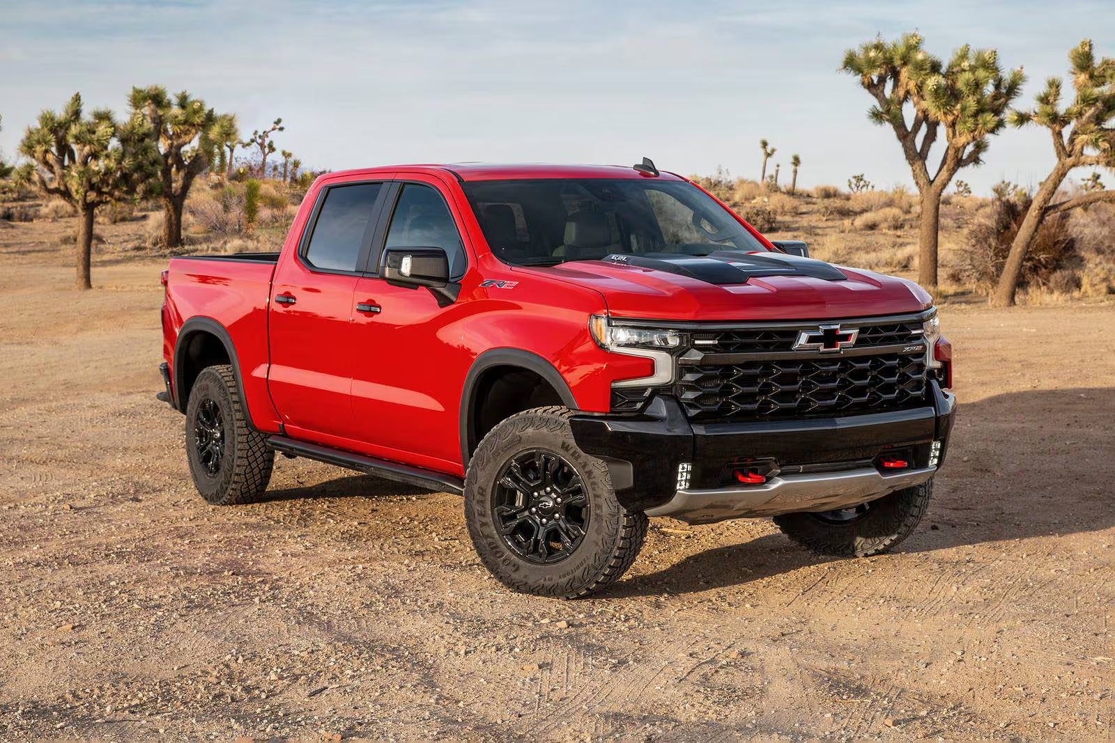 A red truck sitting parked.