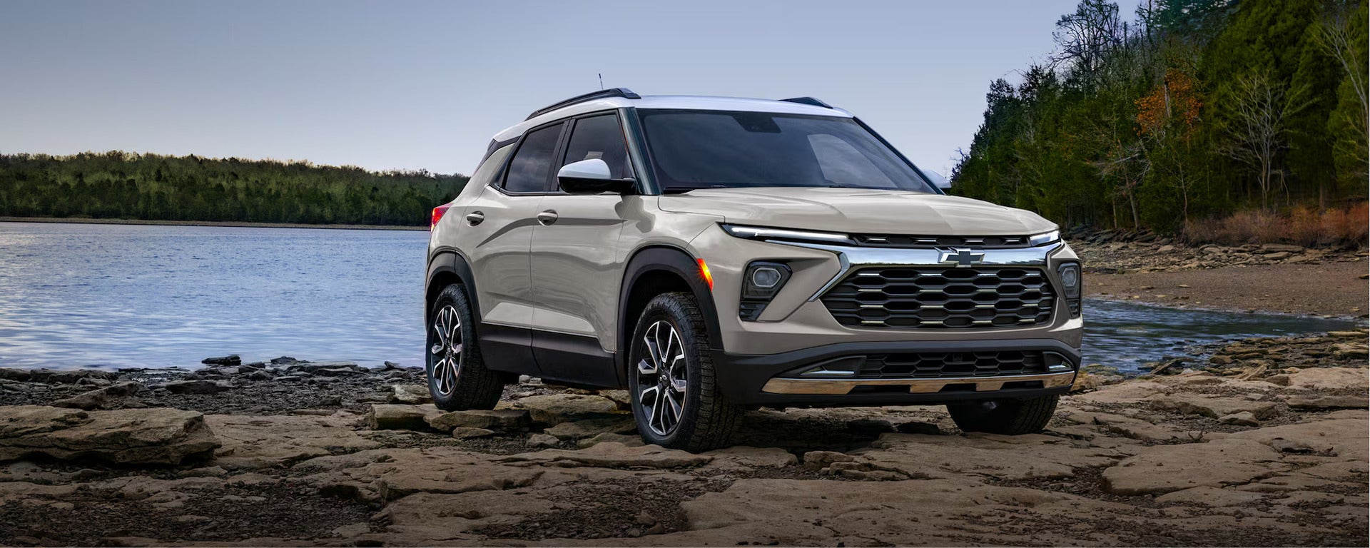 A tan suv sitting parked.